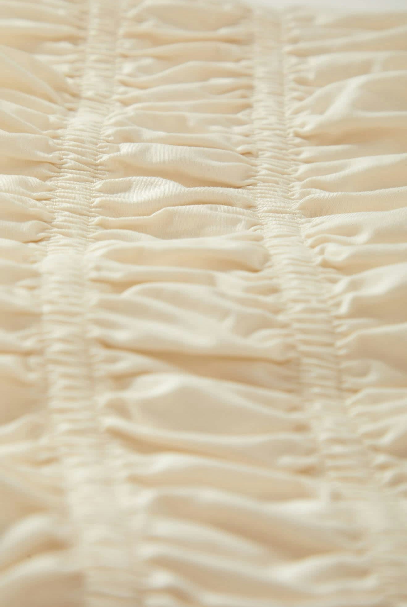 Women's Eden Smocked Top in the color Off White - Additional Laydown image