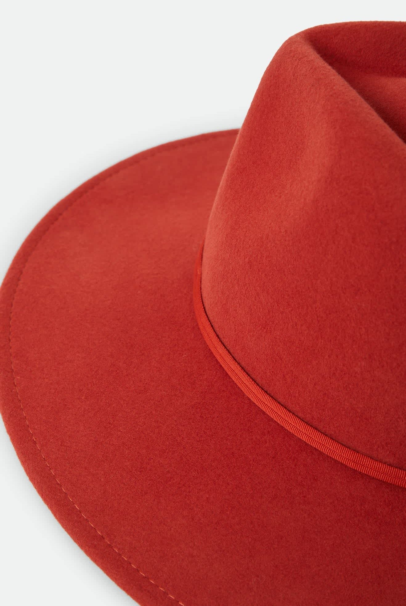 Women's Juniper Packable Hat in the color Red Earth - Additional Laydown image