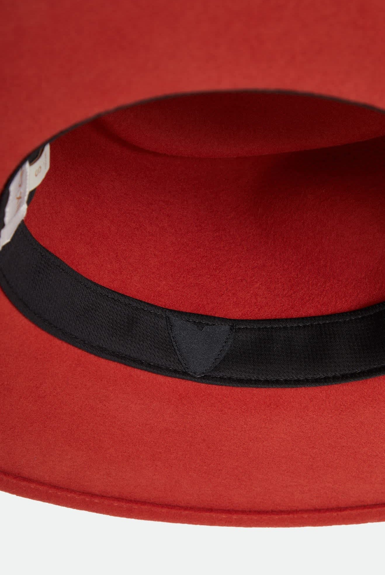 Women's Juniper Packable Hat in the color Red Earth - Additional Laydown image