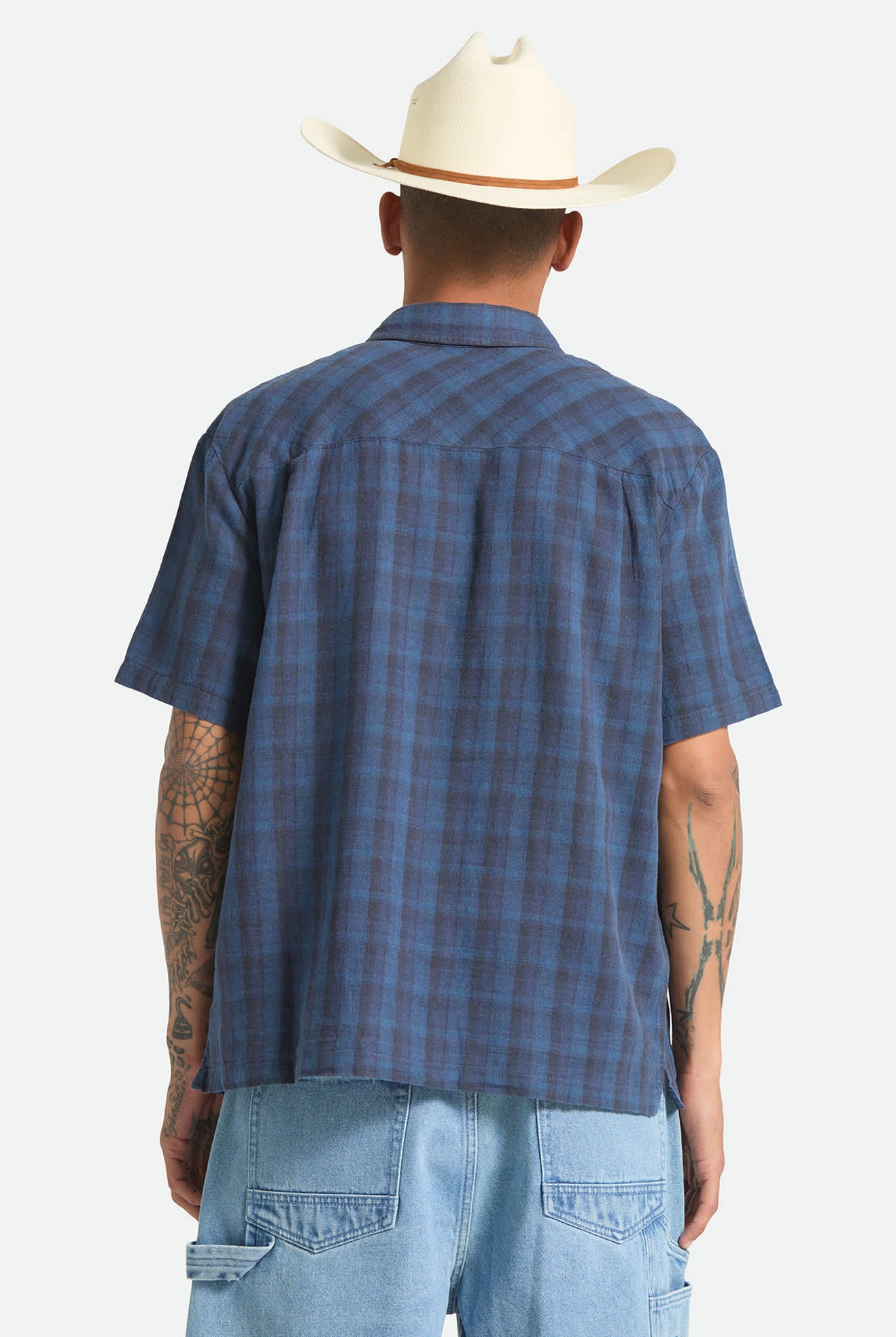 Men's Cru Linen Blend Plaid Short Sleeve Shirt in the color Dark Blue/Black Plaid - Men's Back View