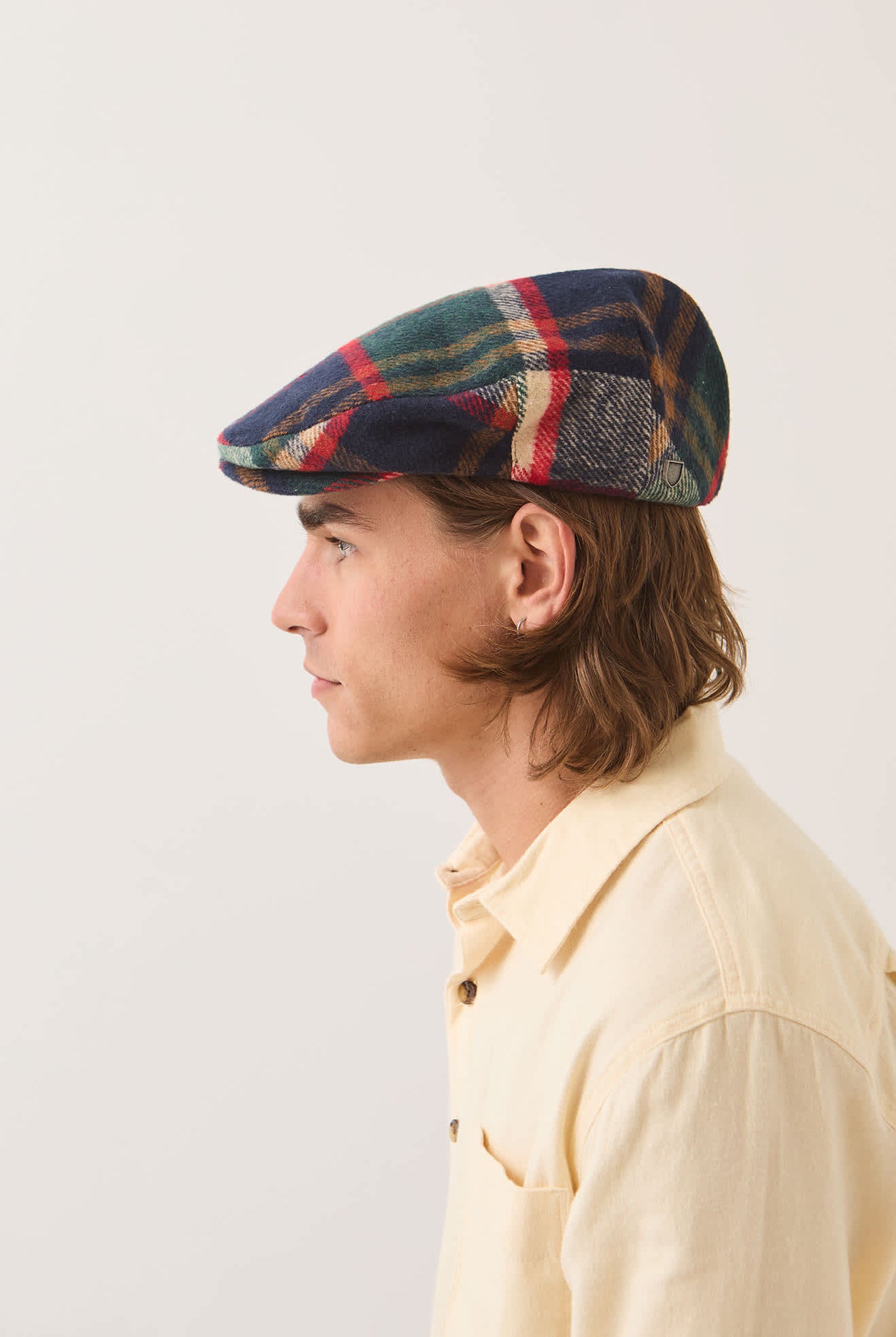Unisex Hooligan Flat Cap in the color Navy/Green/Red/Cream - Men's Side View