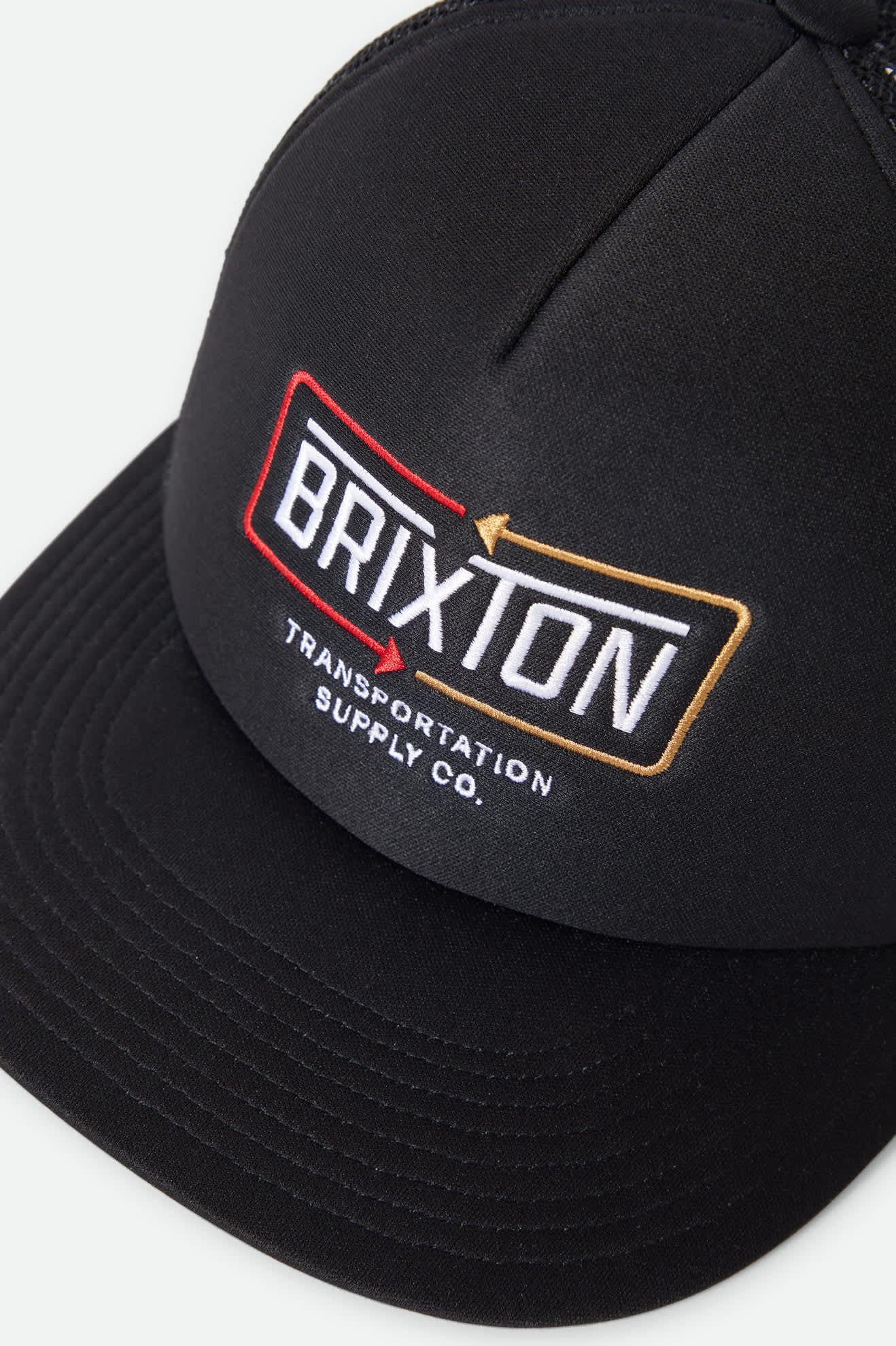 Unisex Caldwell Netplus Trucker Hat in the color Black/Black - Additional Laydown image