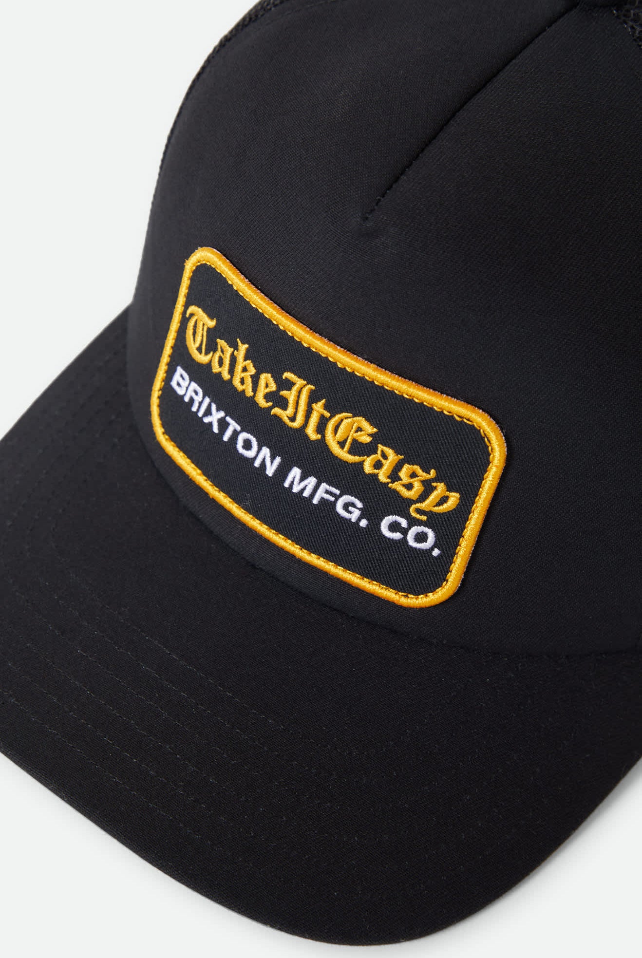 Women's Take It Easy Netplus Trucker Hat in the color Washed Black - Additional Laydown image