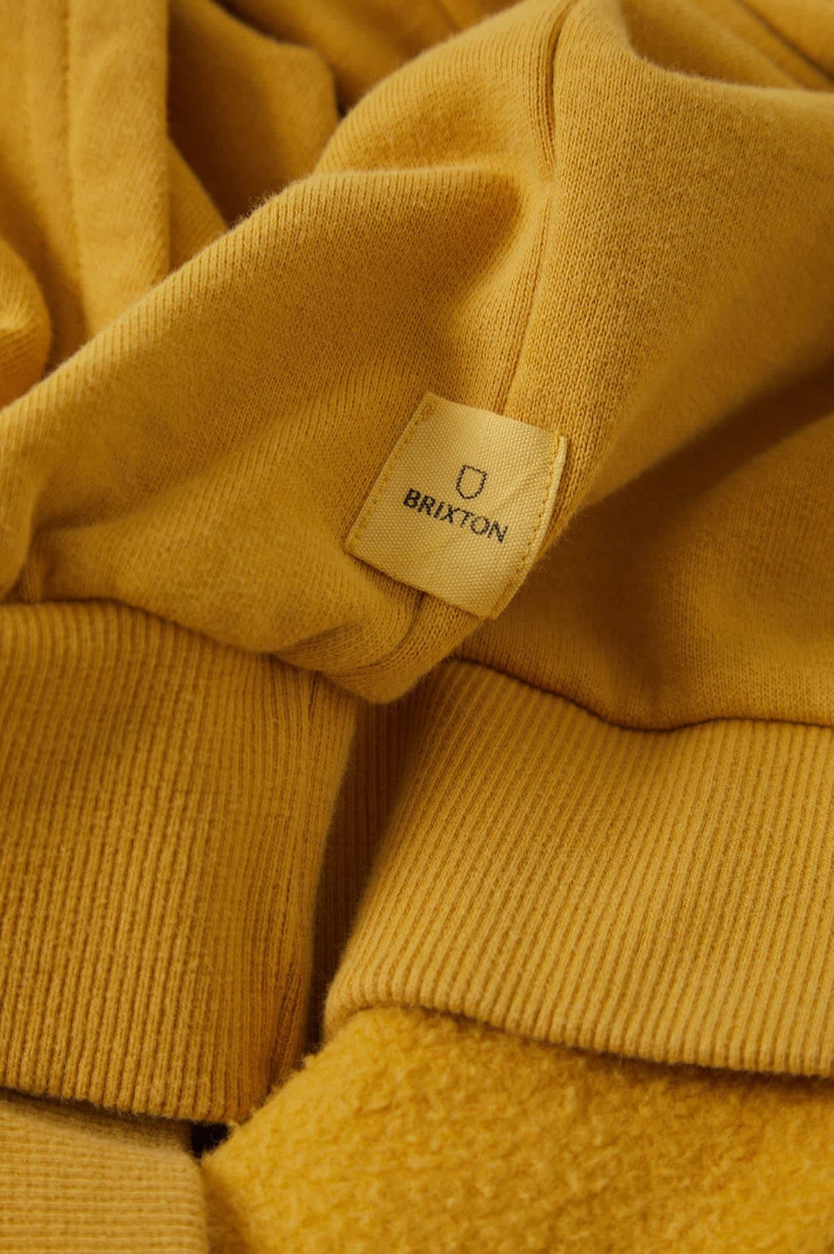 Men's Brixton Baseline Hood Fleece in the color Dusted Ochre Vintage Wash - Additional Laydown image