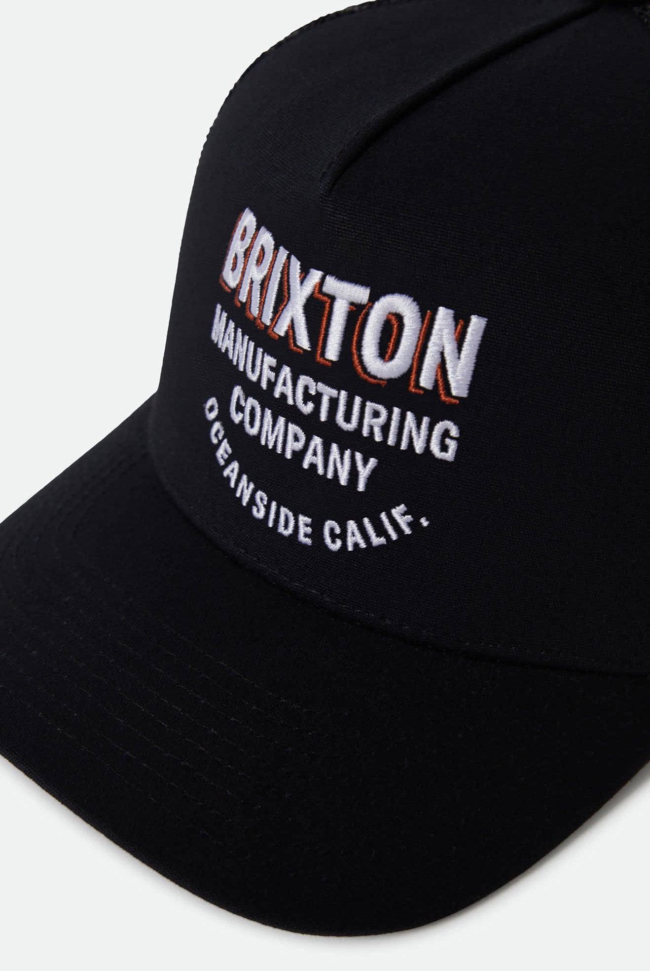 Unisex Crest Netplus Trucker Hat in the color Black/Black - Additional Laydown image