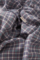 Women's Wayne Women's Shirt in the color Soft Navy Plaid - Additional Laydown image