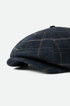 Unisex Brood Newsboy Cap in the color Mood Indigo/Tan - Additional Laydown image