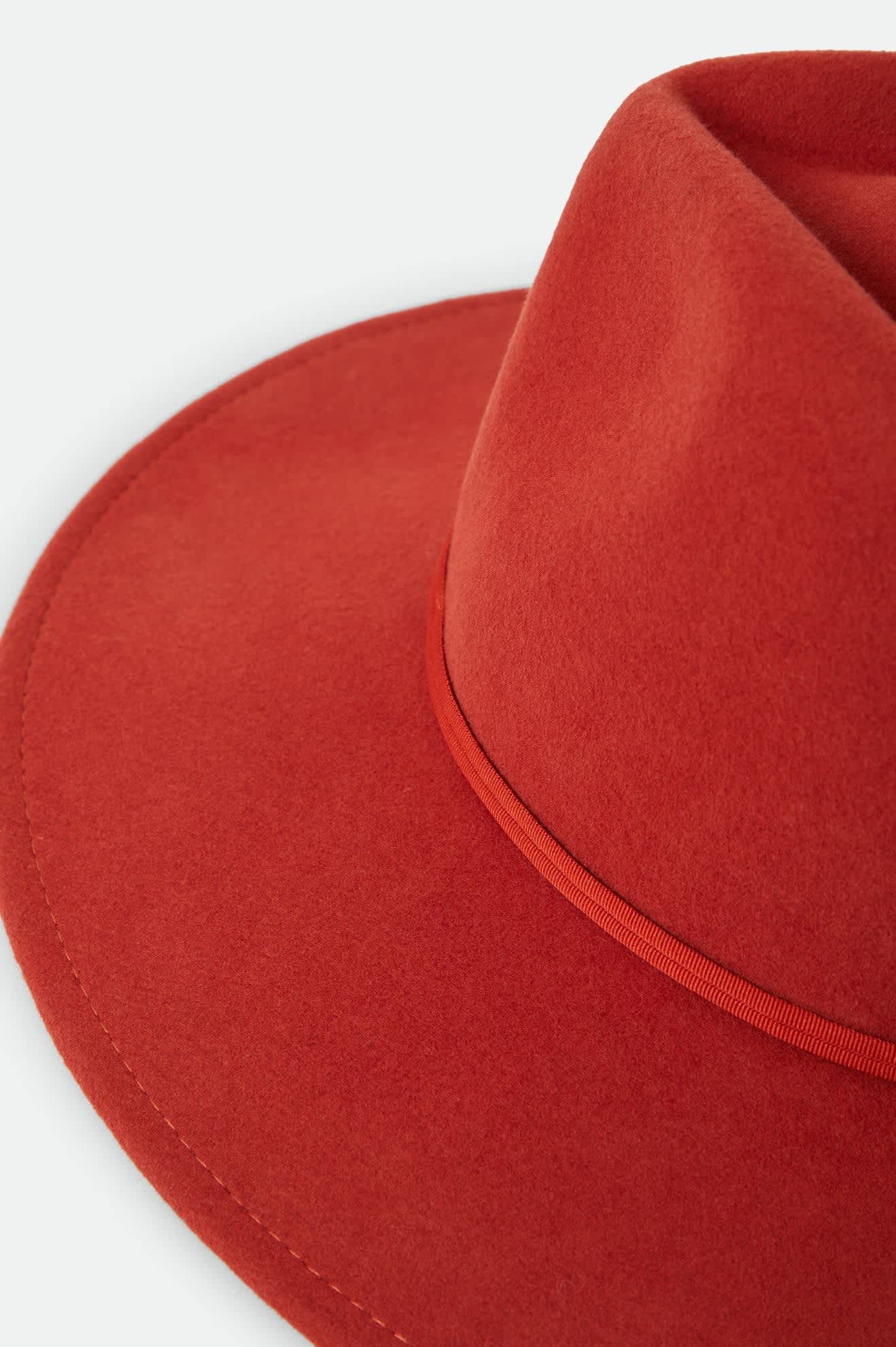 Women's Juniper Packable Hat in the color Red Earth - Additional Laydown image