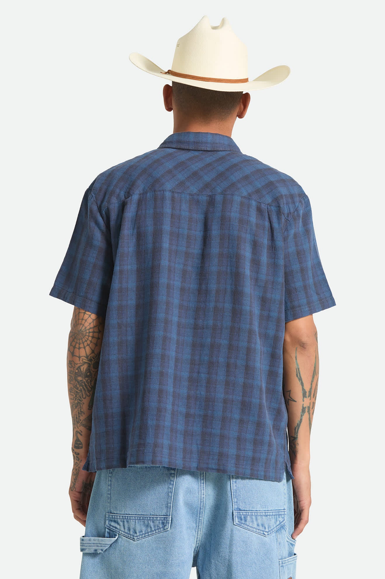 Men's Cru Linen Blend Plaid Short Sleeve Shirt in the color Dark Blue/Black Plaid - Men's Back View