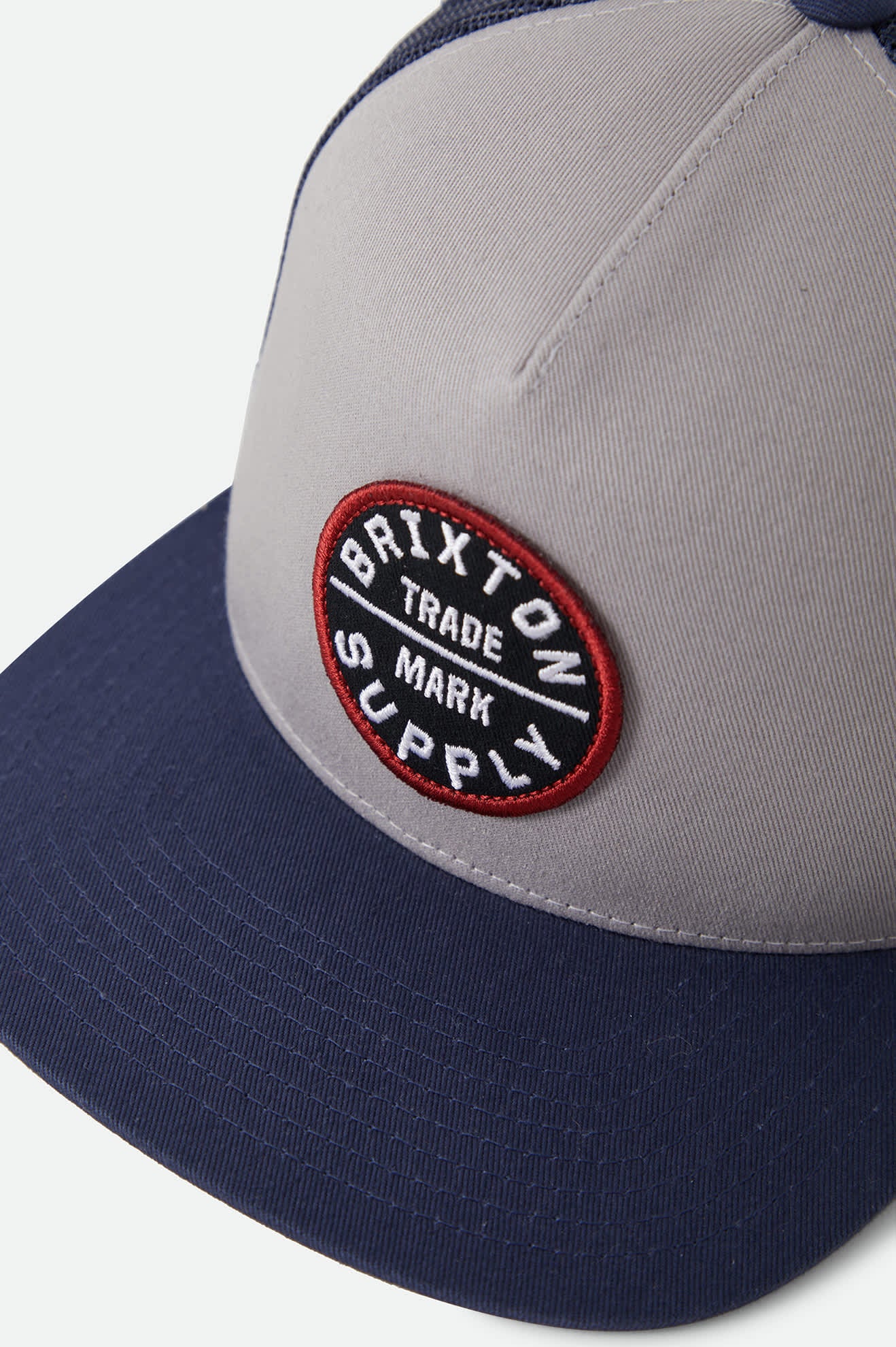 Unisex Oath Trucker Hat in the color Sustained Grey/Washed Navy - Additional Laydown image