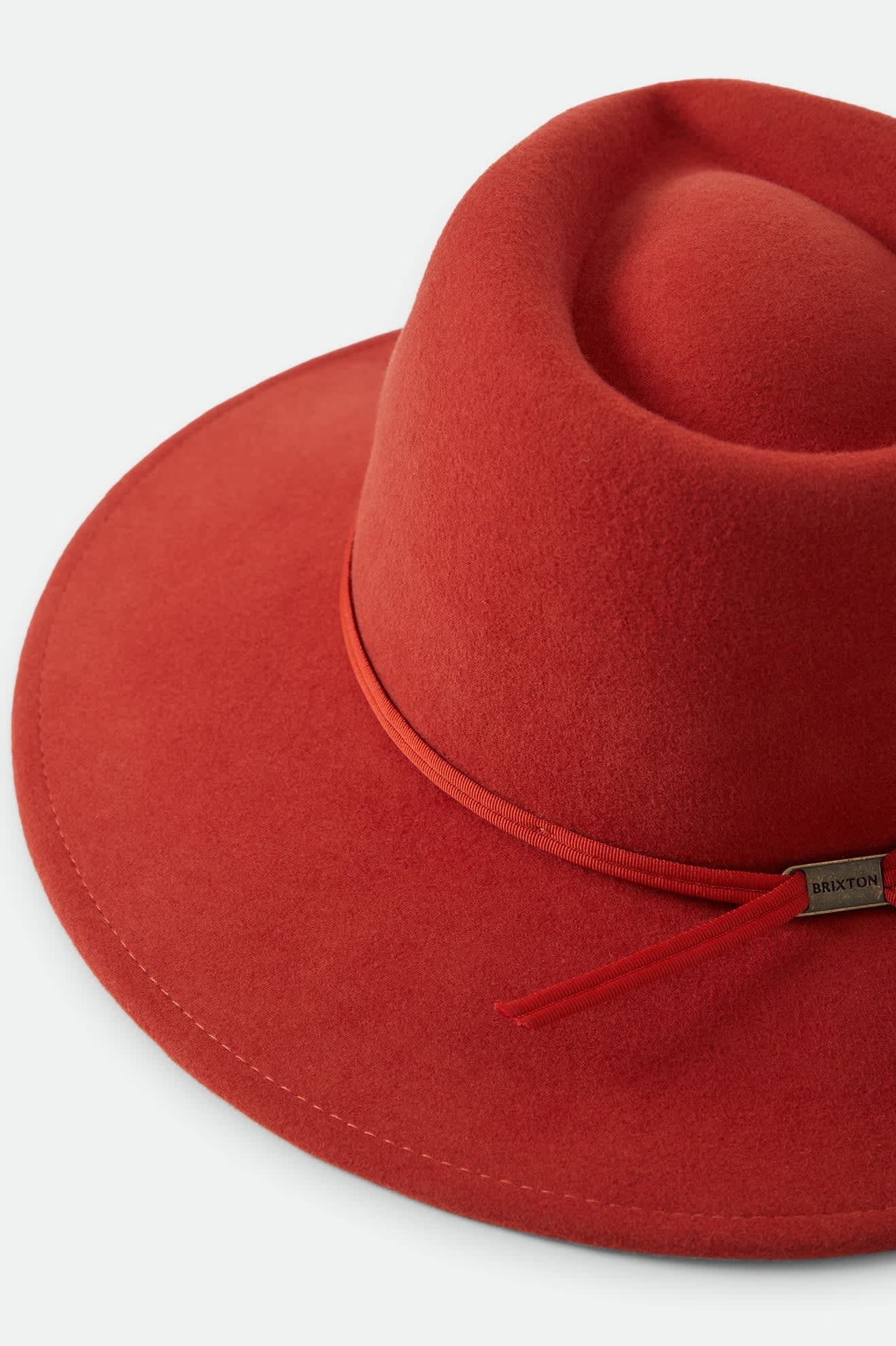 Women's Juniper Packable Hat in the color Red Earth - Additional Laydown image