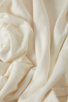 Women's Carefree Organic Garment Dye Cinch T-Shirt in the color Off White - Additional Laydown image