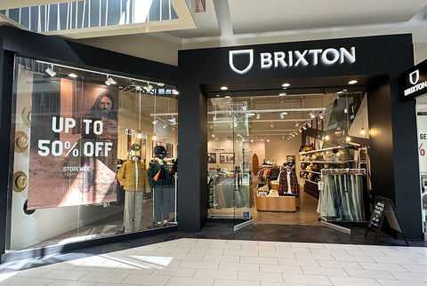 a store front with a sign on the window