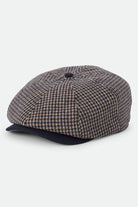 Unisex Brood Newsboy Cap in the color Navy/Sand Houndstooth - Front Product View