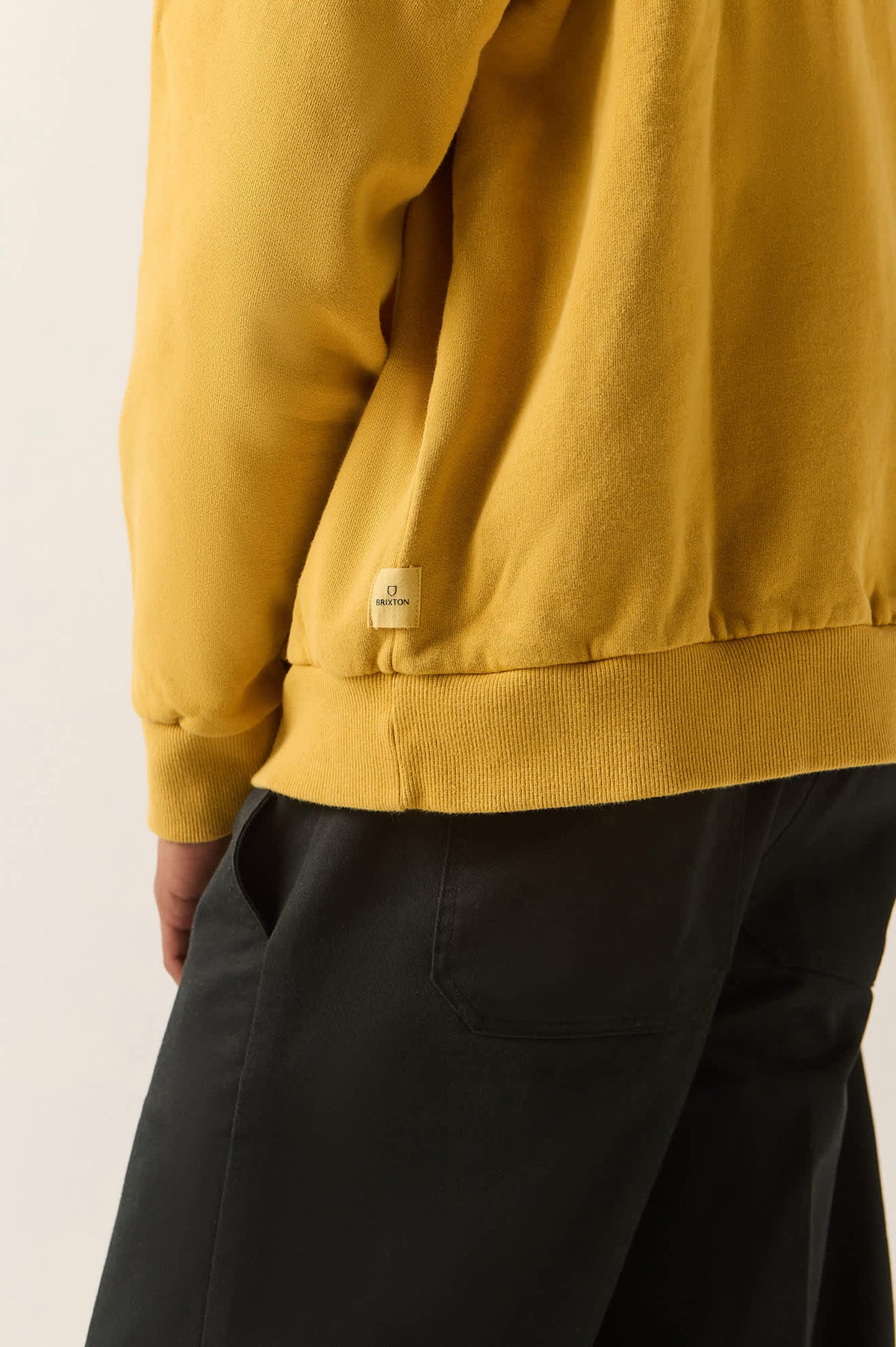 Men's Brixton Baseline Hood Fleece in the color Dusted Ochre Vintage Wash - Additional Fit image