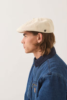 Unisex Brood Newsboy Cap in the color Egret White - Men's Side View
