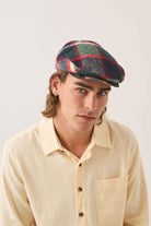 Unisex Hooligan Flat Cap in the color Navy/Green/Red/Cream - Men's Front View