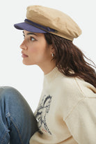 Unisex Fiddler Fisherman Cap in the color Sand/Washed Navy - Women's Side View