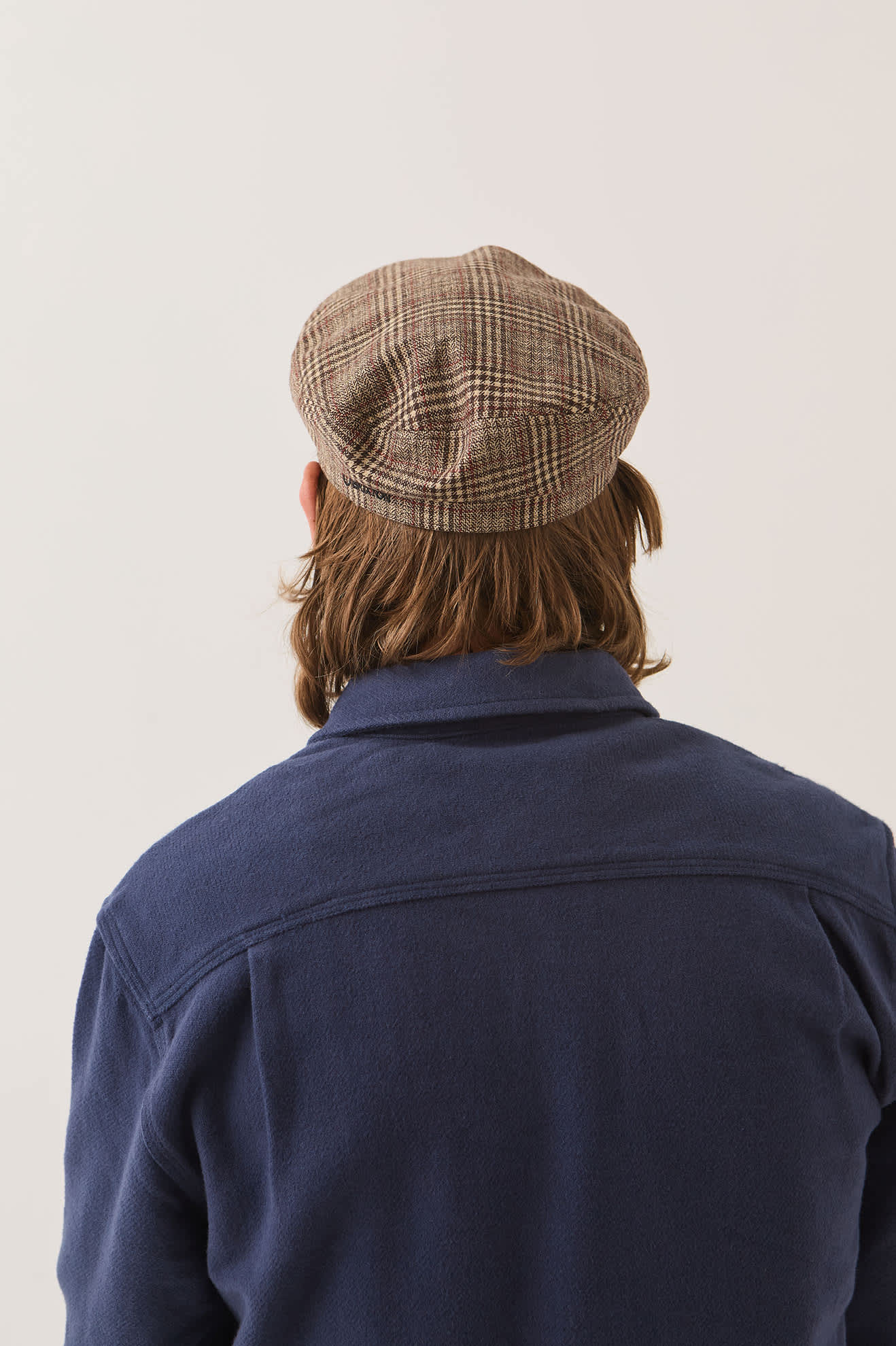 Unisex Fiddler Fisherman Cap in the color Brown/Tan/Red Plaid - Men's Back View