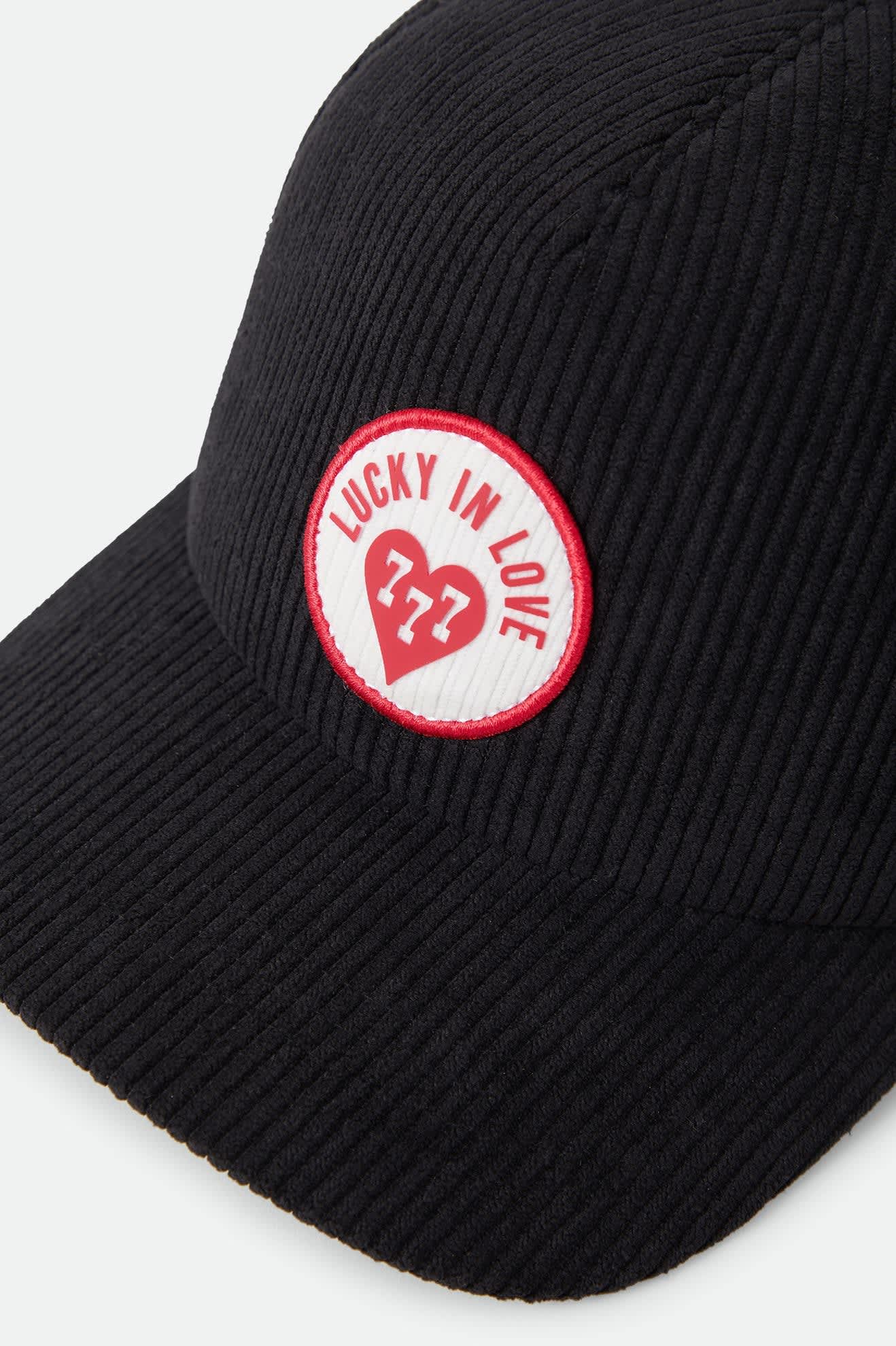 Unisex Lucky In Love Trucker Hat in the color Black - Additional Laydown image