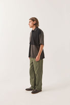 Men's Deco Relaxed Polo T-Shirt in the color Washed Black - Men's Side View