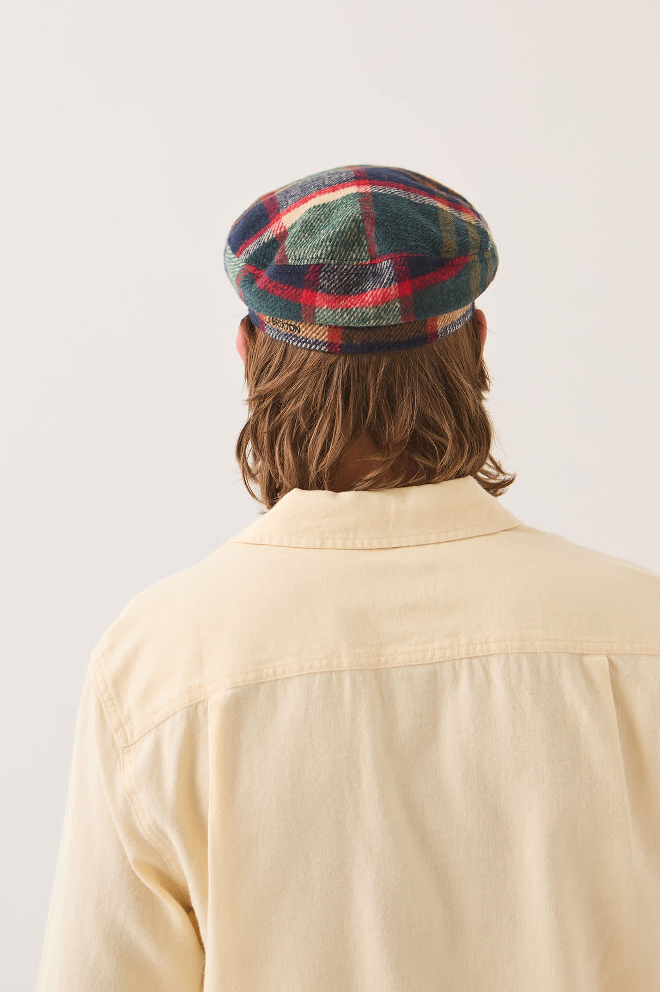 Unisex Fiddler Fisherman Cap in the color Navy/Green/Red/Cream - Men's Back View