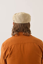 Unisex Hooligan Flat Cap in the color Khaki Stripe/Washed Black - Men's Back View