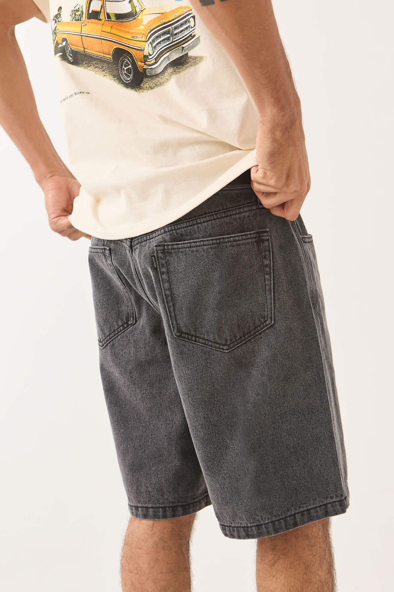 Men's Brixton Relaxed Short in the color Washed Black Denim - Men's Side View