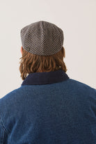Unisex Hooligan Flat Cap in the color Navy/Sand Houndstooth - Men's Back View