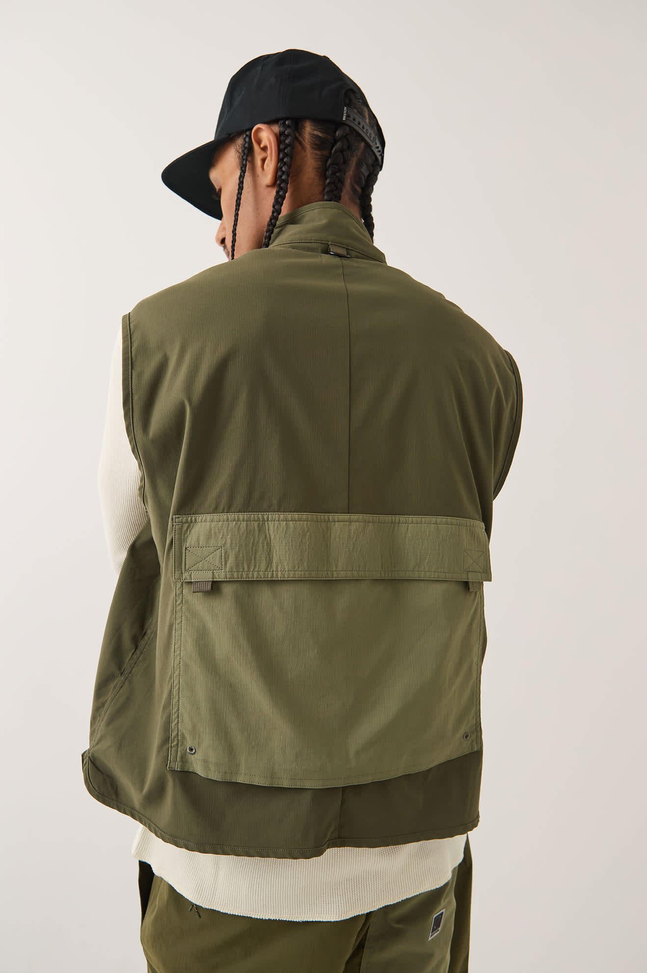 Men's Journey Utility Vest in the color Dark Olive/Olive Surplus - Men's Back View