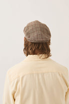 Unisex Hooligan Flat Cap in the color Brown/Tan/Red Plaid - Men's Back View