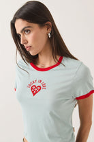 Women's Lucky In Love Baby T-Shirt in the color Sea Grass/Adrenaline Red - Additional Fit image