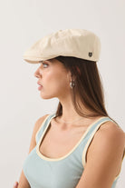 Unisex Brood Newsboy Cap in the color Egret White - Women's Side View