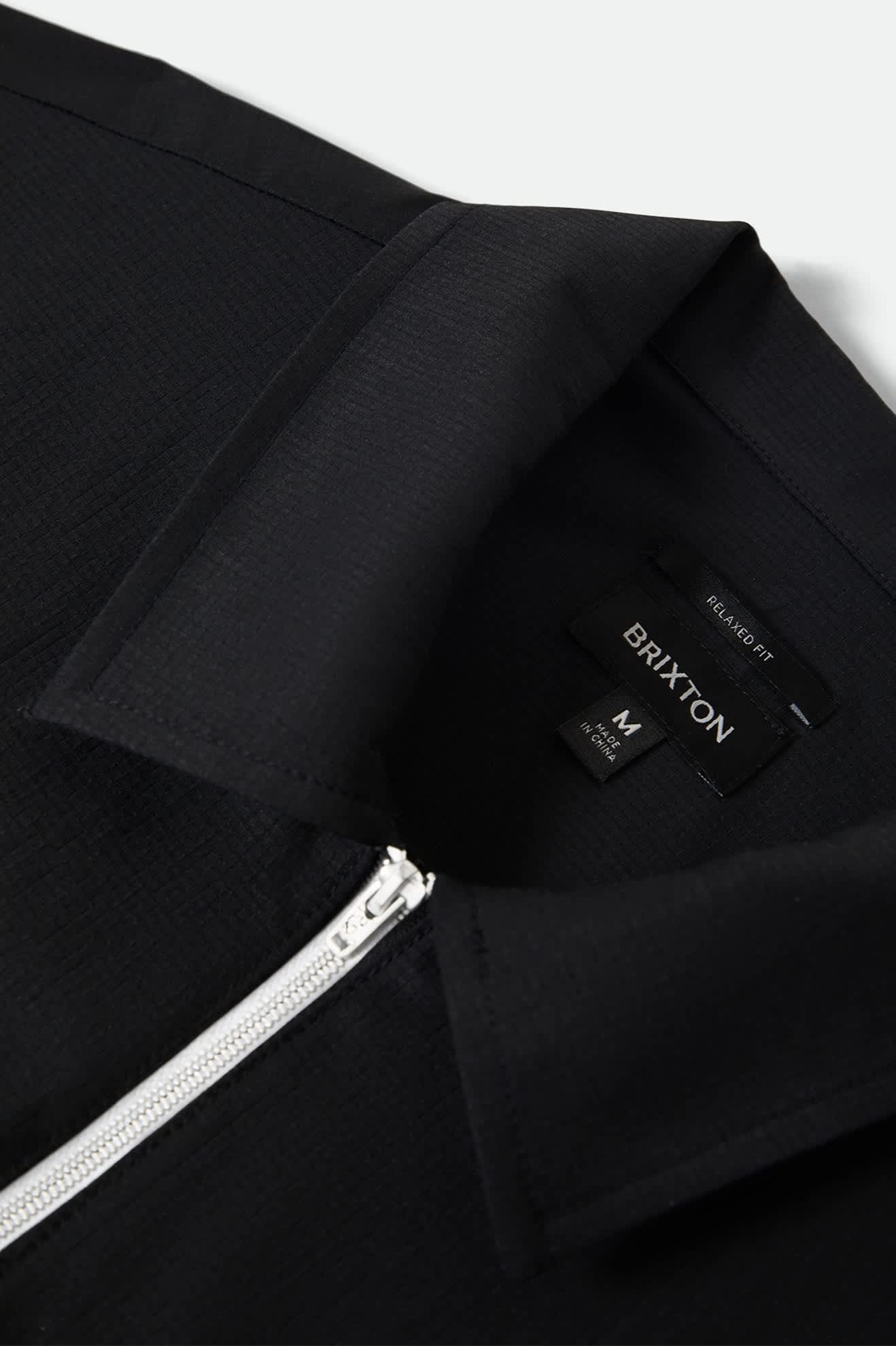 Men's Journey Lightweight 1/2 Zip Cropped Short Sleeve Shirt in the color Black - Additional Laydown image