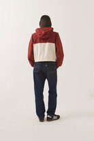 Women's Parsons Lightweight Hooded Windbreaker in the color Dark Brick/Whitecap - Women's Back View