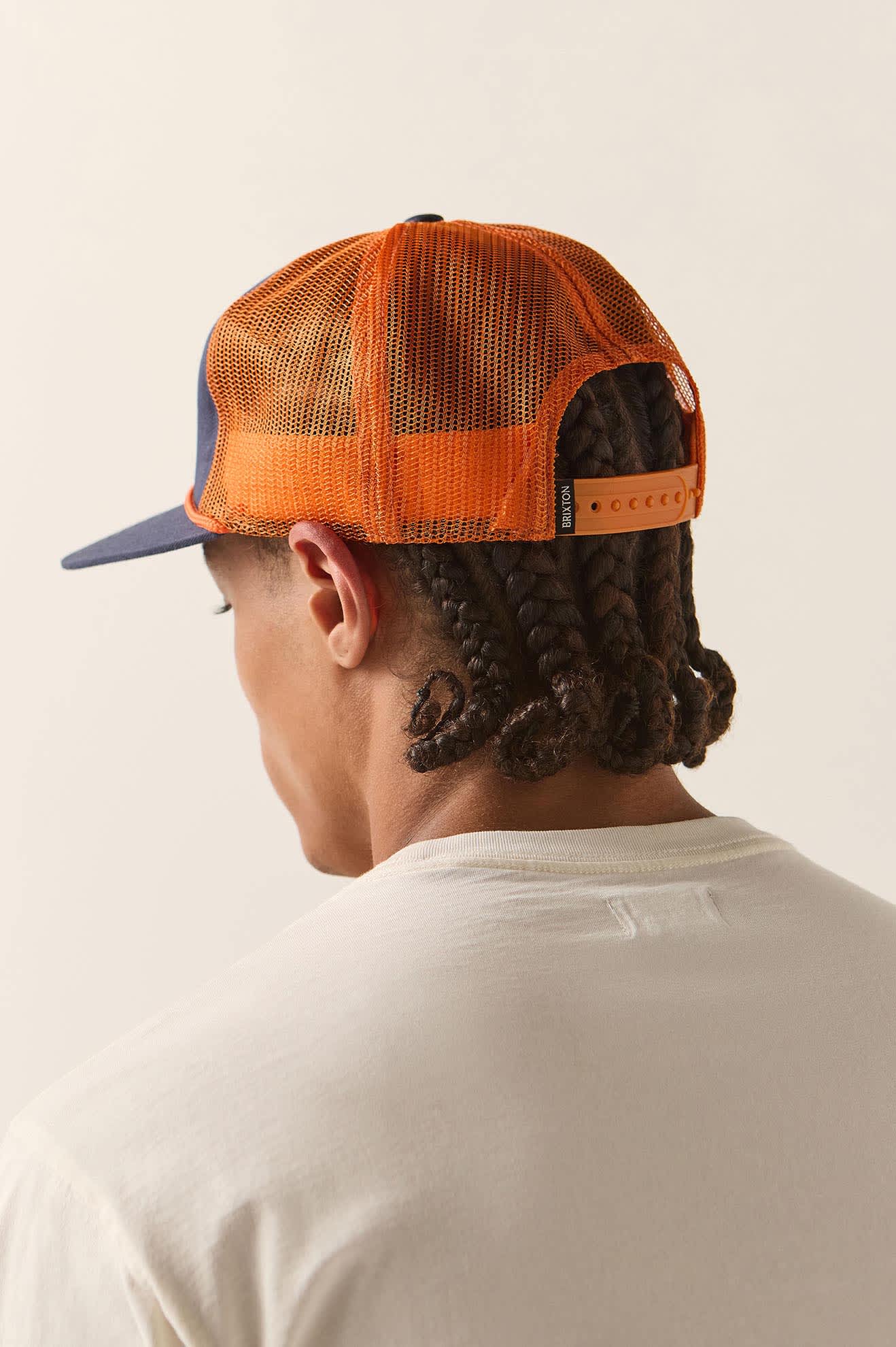Unisex 76 Truck Stop Trucker Hat in the color Navy/Orange - Men's Back View