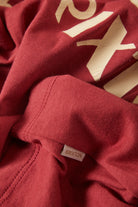 Women's Swallow Sky Cropped Raglan in the color Robust Red/Peach Cobbler - Additional Laydown image