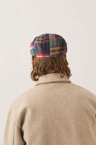 Unisex Brood Newsboy Cap in the color Navy/Green/Red/Cream - Men's Back View