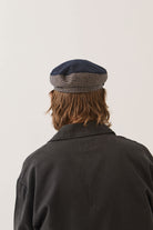 Unisex Fiddler Fisherman Cap in the color Navy/Sand Houndstooth - Men's Back View